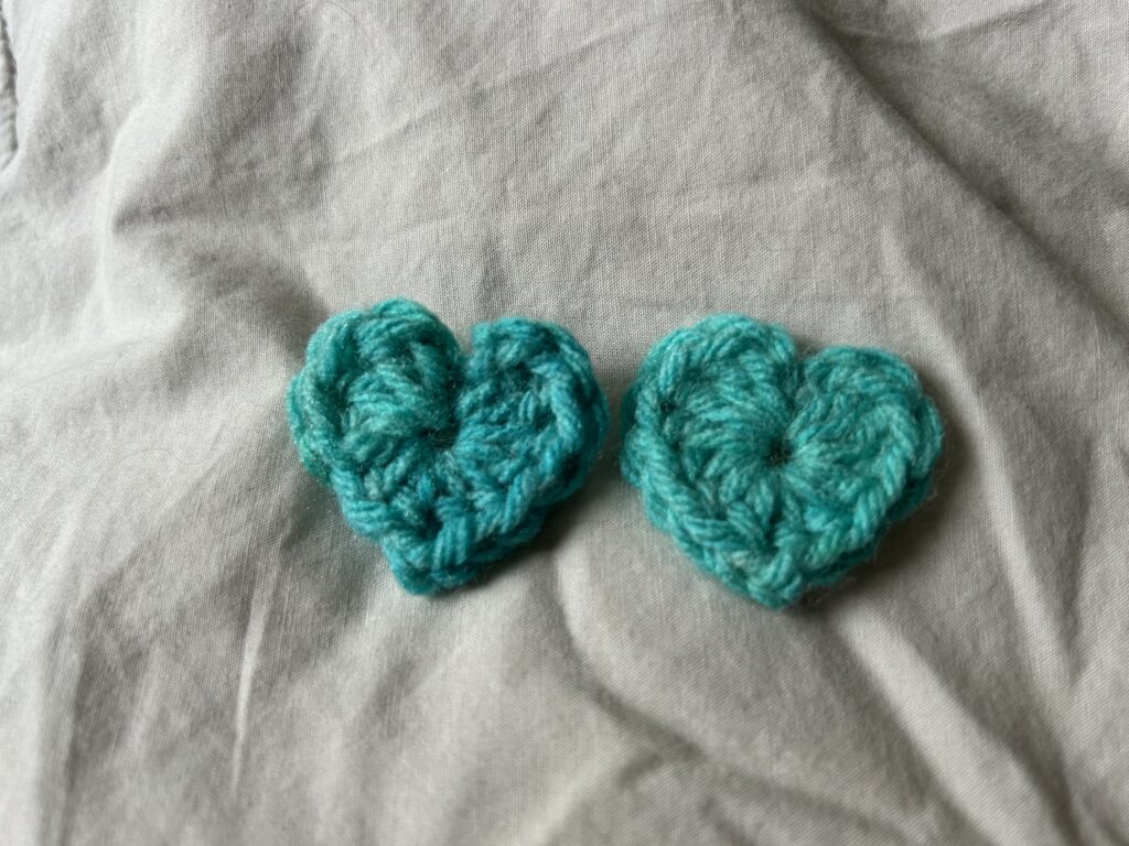 2 mini blue crochet hearts