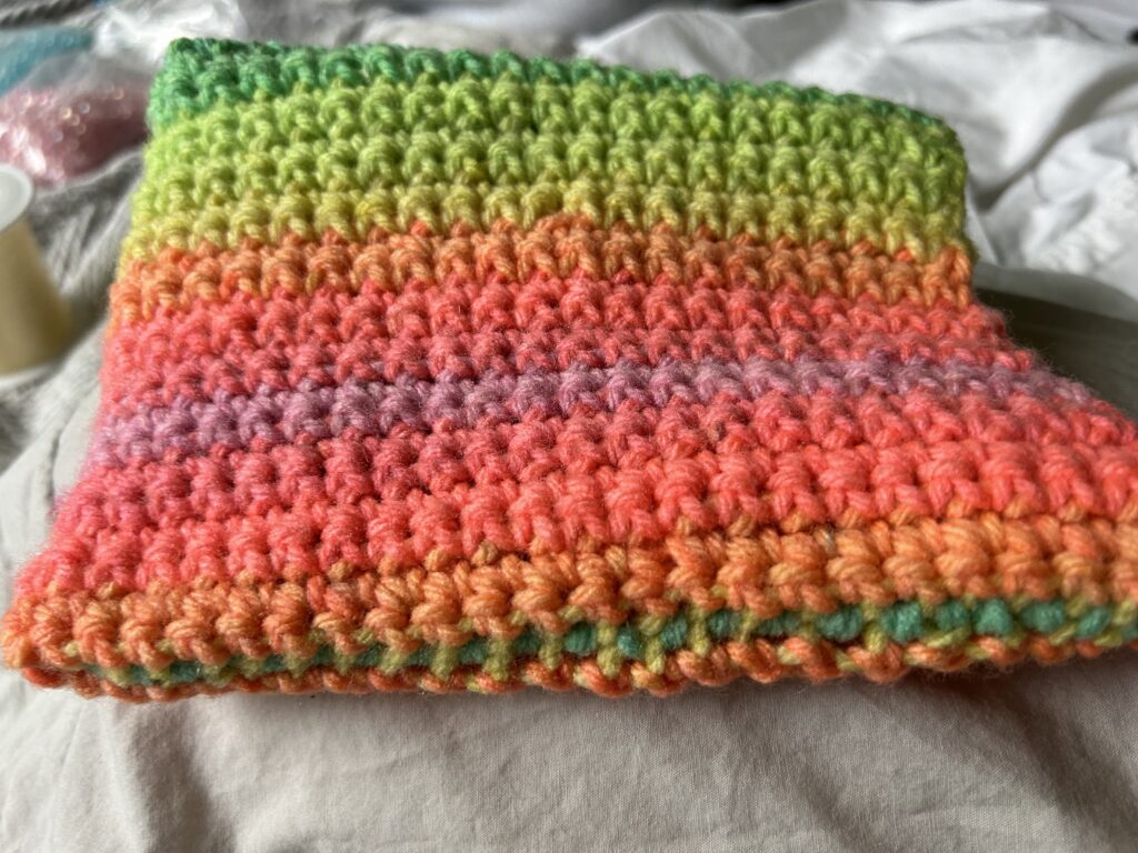 Multi colour single crochet bag.